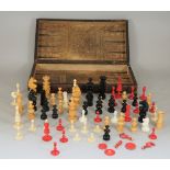 A Victorian folding chess and backgammon board, detailed as a leather bound book, 43cm wide,