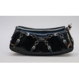 A Dior buckle embellished black patent leather clutch bag of curved rectangular shape and silver