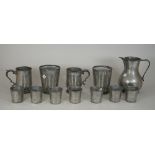 Two 17th century pewter pint tankards, a pewter jug, 19.