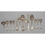 A George III silver caddy spoon, the bowl of oval form with engraved decoration,