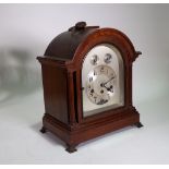 A 1920s oak cased eight day mantel clock with German 'Junghans' movement, 37cm high,