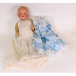 An Armand Marseille bisque headed doll,