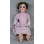 A German painted bisque headed doll, ear