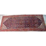A Fereghan runner, Persian, the dark indigo field with an all over herate design,