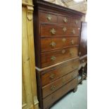 A 19th century mahogany chest on chest with dentil cornice over three short and six long drawers