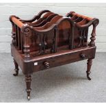 A Victorian rosewood four division Canterbury, with single drawer base on turned supports,