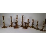 Metalware, comprising; five pairs of 19th century brass candlesticks, the tallest 25cm high, (10).