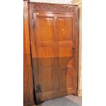 An 18th century and later oak floor standing cupboard with panelled doors, 89cm wide x 127cm high.