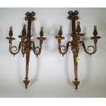 A pair of French gilt bronze three branch wall appliques, late 19th century, with bow surmount,