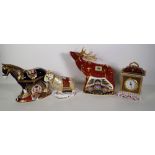 Four Royal Crown Derby Imari paperweights, including a stag, a mantel clock, a horse and a ram, (4).