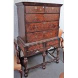 A 17th century and later burr yew chest on stand with two short over three long drawers,