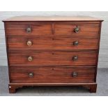 A late George III mahogany chest of two short and three long graduated drawers on bracket feet,