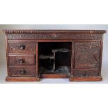 A late 19th century Chinese Export carved hardwood side cabinet with an arrangement of five drawers