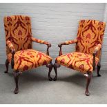 A pair of mid-18th century style open armchairs, on carved mahogany cabriole supports,