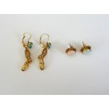 A pair of 9ct gold and opal single stone earstuds,