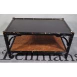 OKA; a black painted rectangular coffee table with cane undertier, 93cm wide x 20cm high.