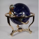 A 20th century specimen stone table globe, on a brass metal base, approx. 48cm wide x 45cm high.
