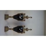 A pair of 19th century style table lamps, gilt metal and black pottery,