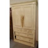 An early 20th century white panted pine linen press with two short and two long drawers on plinth