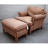 A modern check upholstered easy armchair, on tapering square supports, with matching foot stool,