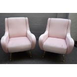 A pair of retro design pink upholstered easy armchairs, on tubular lacquered brass supports,