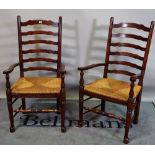 A set of eight 18th century style oak Lancashire ladder back dining chairs, to include two carvers,