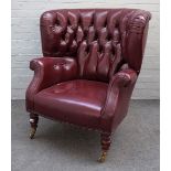 Baker Furniture; a 20th century rouge leather upholstered tub back armchair, on turned supports,