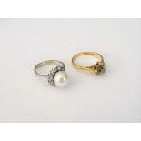 A white gold, cultured pearl and diamond ring,