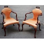 Baker Furniture; a pair of George III style open arm side chairs,