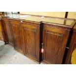 A George III mahogany breakfront side cabinet with four panelled doors, 200cm wide x 102cm high.