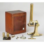 An early 20th century students microscope, lacquered brass,