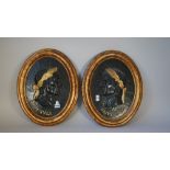 A pair of modern giltwood oval panels,