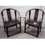 A pair of 19th century Chinese hardwood horseshoe back armchairs,