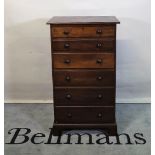 An early 20th century mahogany tall chest of six long graduated drawers on bracket feet.