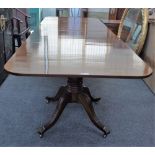 A George III and later mahogany twin pedestal extending dining table, on eight downswept supports,