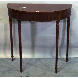 A Louis XVI style walnut console table on fluted tapering supports, 83cm wide x 83cm high.