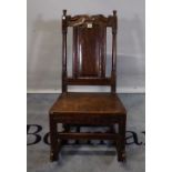 An 18th century and later oak low rocking chair.