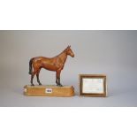 A Royal Worcester porcelain model of Arkle, Ltd edition 106/500 by Doris Linder, on a wooden base,