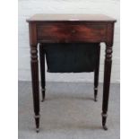 A Regency mahogany work table with fitted drawer over wool box on reeded supports,