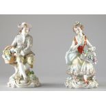 A pair of Sitzendorf porcelain figures, 20th century, modelled as male and female flower sellers,