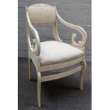 A 19th century and later white painted Swedish open armchair on sabre supports,