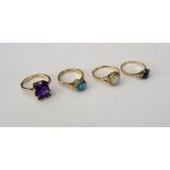 A gold ring, claw set with a rectangular step cut amethyst, detailed 9 CT, a gold ring,