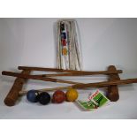 An early 20th century part croquet set, unboxed.