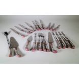 A part suite of cutlery with German porcelain handles comprising; seven knives, seven forks,