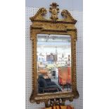A George II and later gilt framed mirror, with cartouche crest,