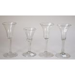Three plain stemmed wine glasses, 18th/19th century,each with bell bowl and folded foot, tallest 17.