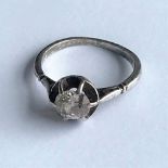 A diamond set and white metal single stone ring, the old mine cut diamond,