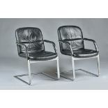 Klober, a pair of black leather and chrome open armchairs, circa 1987, 60cm wide x 87cm high.