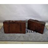 An early 20th century leather suitcase, 80cm wide x 23cm high, and another smaller,