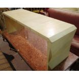 A 20th century white laminate rectangular coffee table on outswept trestle end supports,